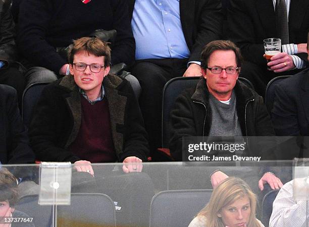 Michael J. Fox and son, Sam Fox attend the Pittsburgh Penguins vs New York Rangers game at Madison Square Garden on January 19, 2012 in New York City.