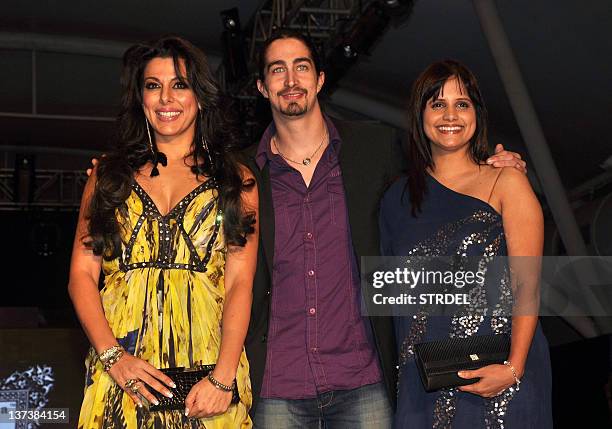 Indian Bollywood actress Pooja Bedi with brother Adam Bedi and Nisha Harale pose during the 'India Kids Fashion Week 2012' fashion show in Mumbai on...