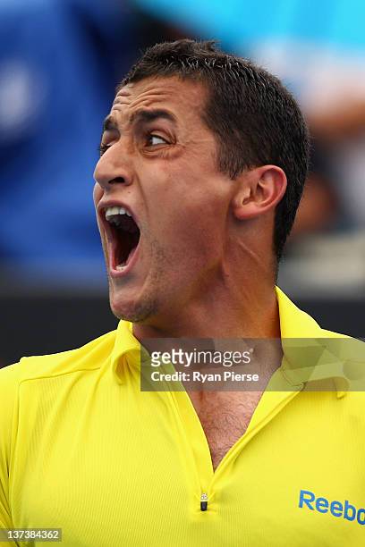 Nicolas Almagro of Spain yells in his third round match against Stanislas Wawrinka of Switzerland during day five of the 2012 Australian Open at...