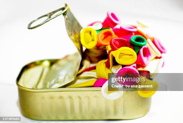 sardine tin filled with colorful balloons - sardine can stock pictures, royalty-free photos & images