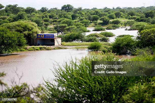 General view of flooding on January 19, 2012 in Hoedspruit, South Africa. People were plucked from the roofs of their submerged houses and others...