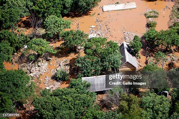 Aerial view of a flooded area on January 19, 2012 in Hoedspruit, South Africa. People were plucked from the roofs of their submerged houses and...