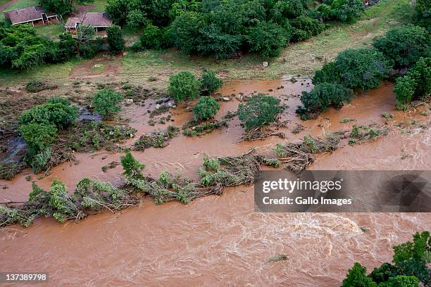 Aerial view of a flooded area on January 19, 2012 in Hoedspruit, South Africa. People were plucked from the roofs of their submerged houses and...