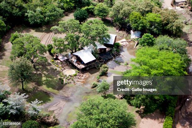 Aerial view of a flooded area on January 19, 2012 in Hoedspruit, South Africa. People were plucked from the roofs of their submerged houses and...