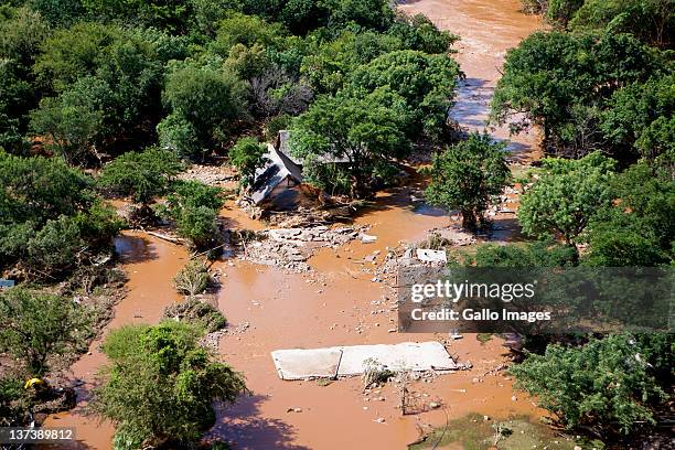 Aerial view of a flooded area on January 19, 2012 in Hoedspruit, South Africa. People were plucked from the roofs of their submerged houses and...