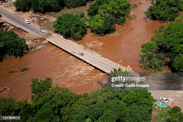 Aerial view of a flooded area on January 19, 2012 in Hoedspruit, South Africa. People were plucked from the roofs of their submerged houses and...