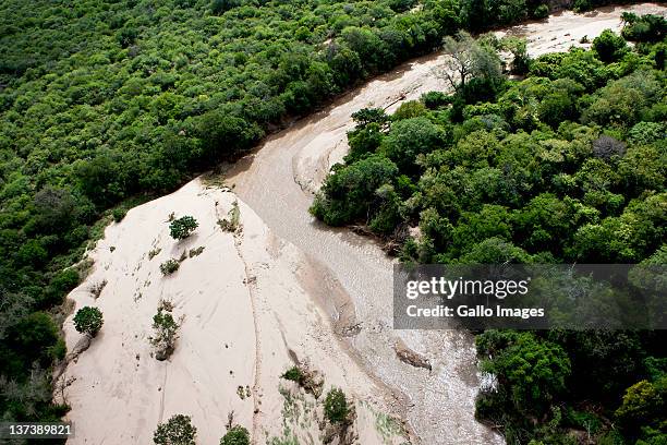 Aerial view of a flooded area on January 19, 2012 in Hoedspruit, South Africa. People were plucked from the roofs of their submerged houses and...