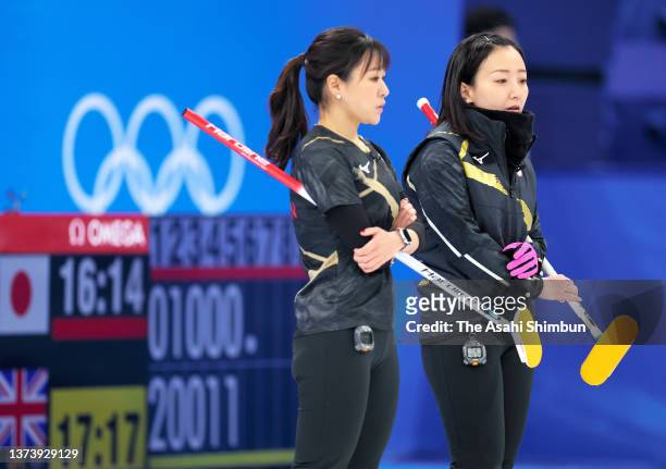 Chinami Yoshida and Satsuki Fujisawa of Team Japan discuss in the 6th end during the Women's Gold Medal match between Team Japan and Team Great...