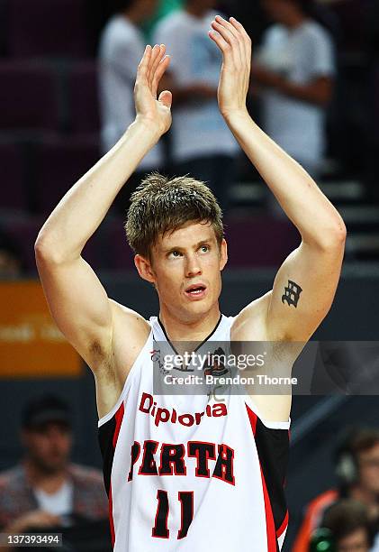 Cameron Tovey of the Wildcats gestures to the crowd after the Wildcats claimed victory over the Kings during the round 16 NBL match between the...