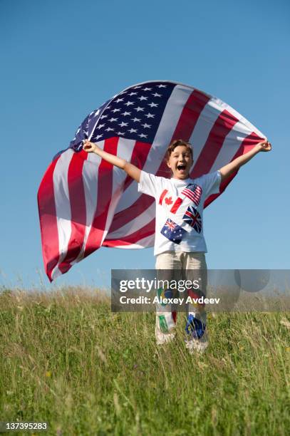 happy child with large american flag - eu flag union jack stock pictures, royalty-free photos & images