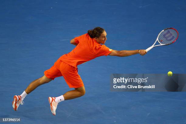Alexandr Dolgopolov of the Ukraine plays a backhand in his third round match against Bernard Tomic of Australia during day five of the 2012...