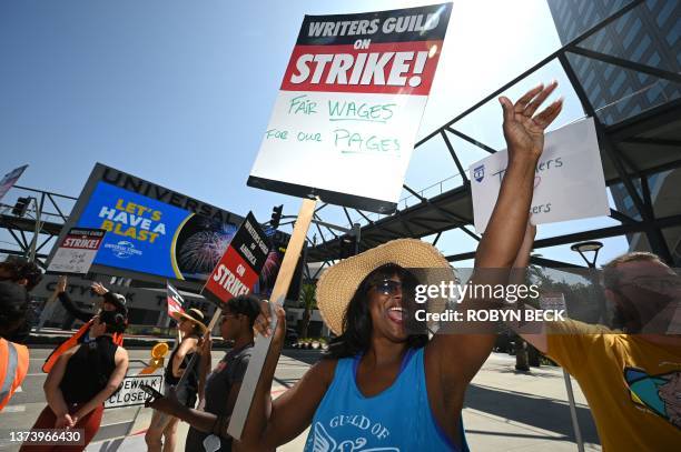 Hollywood writers and their supporters walk the picket line outside Universal Studios Hollywood in Los Angeles, California, June 30, 2023....