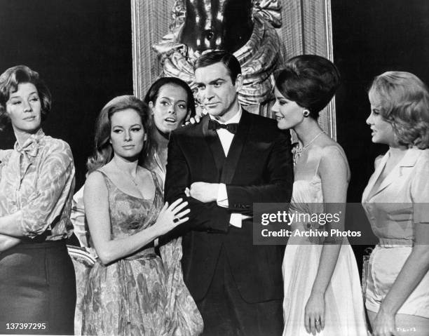 Actor Sean Connery with , Lois Maxwell, Luciana Paluzzi, Martine Beswick, Claudine Auger and Molly Peters, his female co-stars from the film...