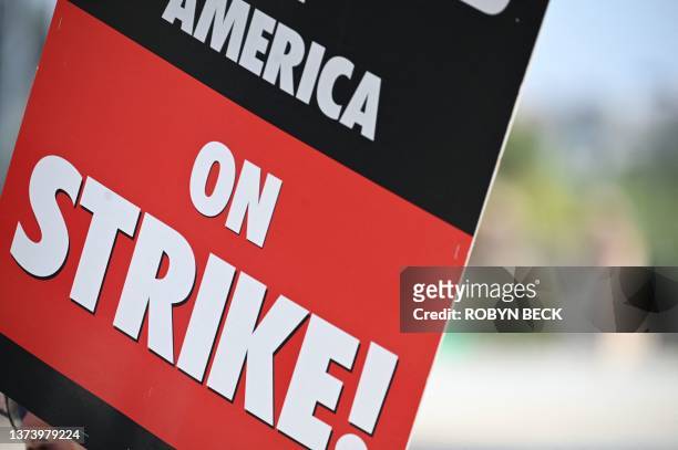 Strike sign is seen on the Hollywood writers picket line outside Universal Studios Hollywood in Los Angeles, California, June 30, 2023. Hollywood's...