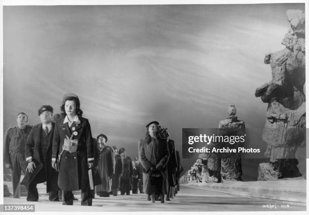 New entrants are taken to the Other World on an immense moving staircase in a scene from the film 'Stairway to Heaven', 1947.