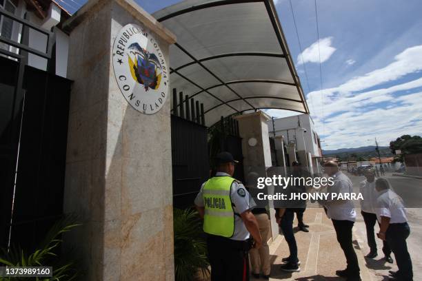 Member of the Bolivarian National Police at the service of the diplomatic corps watches Colombian diplomatic personnel entering the Colombian...