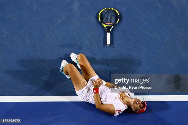 Anabel Medina Garrigues of Spain lays on the court after injuring her ankle in her third round match against Na Li of China during day five of the...