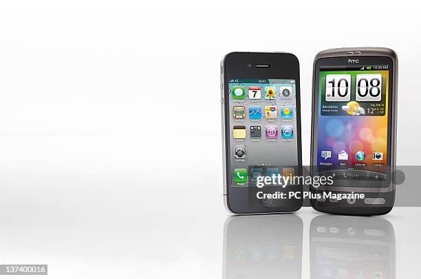 An Apple iPhone 4 and HTC Desire smartphone, session for PC Plus Magazine taken on October 25, 2010.