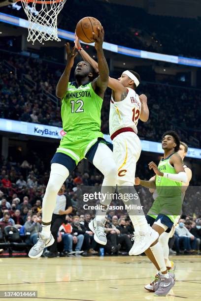 Taurean Prince of the Minnesota Timberwolves shoots over Tim Frazier of the Cleveland Cavaliers during the first quarter at Rocket Mortgage...