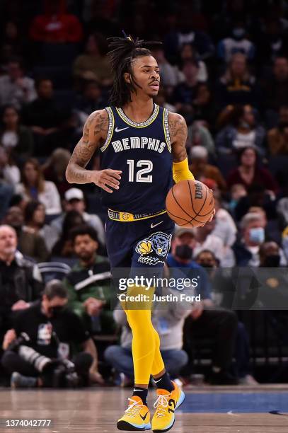 Ja Morant of the Memphis Grizzlies brings the ball upcourt during the first half against the San Antonio Spurs at FedExForum on February 28, 2022 in...