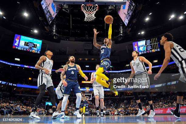 Ja Morant of the Memphis Grizzlies goes to the basket against the San Antonio Spurs during the first half at FedExForum on February 28, 2022 in...