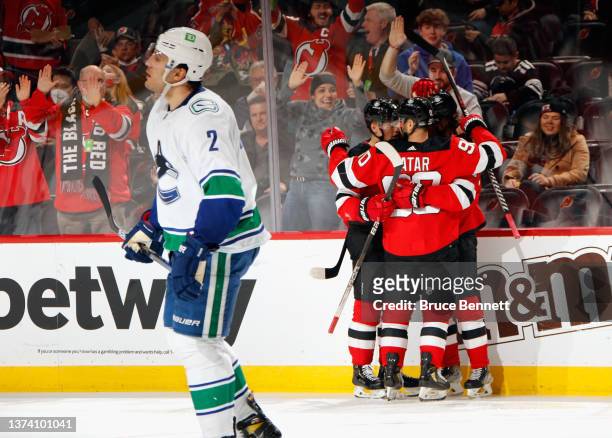 The New Jersey Devils celebrate a second period goal by Jesper Boqvist against the Vancouver Canucks at the Prudential Center on February 28, 2022 in...