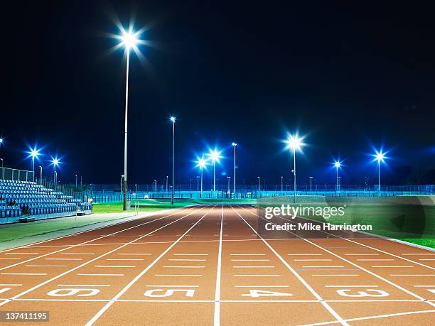 race track at night - athletics track stock pictures, royalty-free photos & images