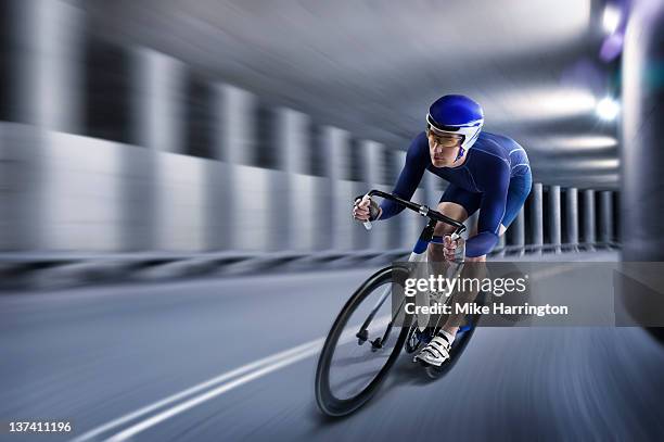 professional male cyclist in tunnel - track cycling stock pictures, royalty-free photos & images