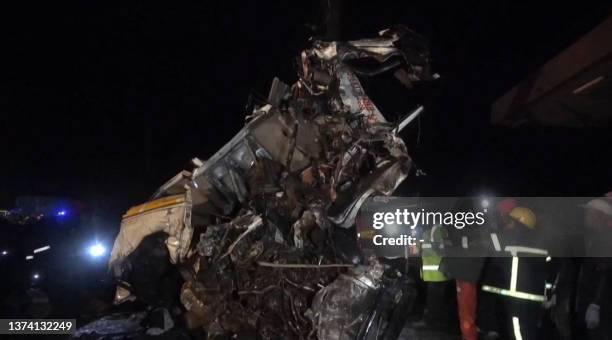 This video grab taken from an AFPTV video on June 30, 2023 shows the wreckage of a vehicle on the scene after an accident on the highway between the...