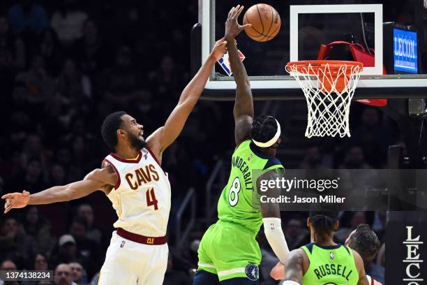 Evan Mobley of the Cleveland Cavaliers fouls Jarred Vanderbilt of the Minnesota Timberwolves during the second half at Rocket Mortgage Fieldhouse on...