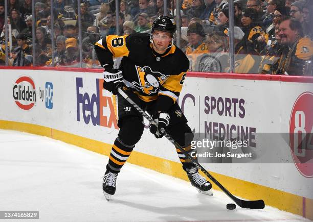 Brian Dumoulin of the Pittsburgh Penguins skates against the New Jersey Devils at PPG PAINTS Arena on February 24, 2022 in Pittsburgh, Pennsylvania.