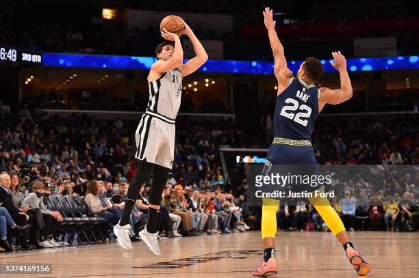 Doug McDermott of the San Antonio Spurs takes a shot against Desmond Bane of the Memphis Grizzlies during the second half at FedExForum on February...