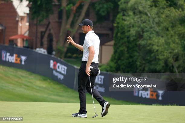 Golfer Cam Davis reacts to making a birdie putt on the 8th hole on June 30 during the second round of the Rocket Mortgage Classic at the Detroit Golf...