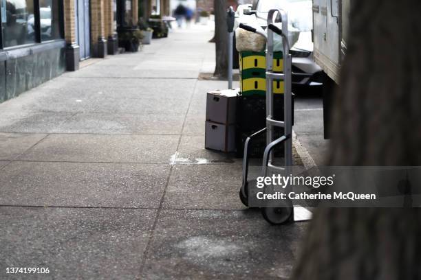 delivery being prepared & loaded on sidewalk for small business - hand truck in view - consumer confidence stock pictures, royalty-free photos & images