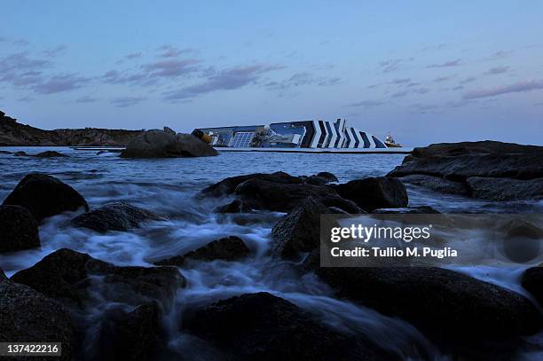 Cruise ship Costa Concordia lies stricken off the shore of the island of Giglio on January 20, 2012 in Giglio Porto, Italy. The rescue operation to...