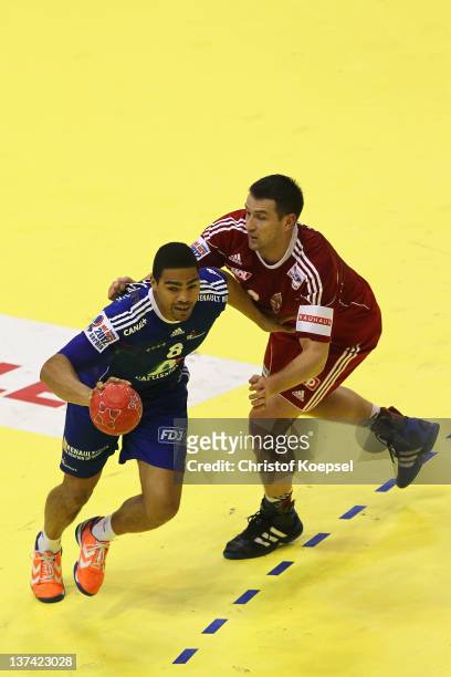 Ferenc Ilyes of Hungary defends against Daniel Narcisse of France during the Men's European Handball Championship group C match between France and...