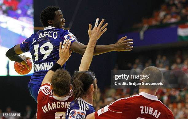 Abalo Luc of France jumps to shoot over Gergo Ivancsik and Szabolcs Zubai of Hungary, during the Men's European Handball Championship 2012 group C...