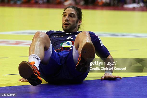 Bertrand Gille of France lies on the pitch during the Men's European Handball Championship group C match between France and Hungary at Spens Arena on...