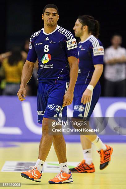 Daniel Narcisse and Bertrand Gille of France look dejected after losing 23-26 the Men's European Handball Championship group C match between France...
