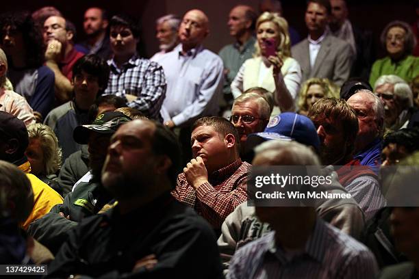 South Carolinians listen as Republican presidential candidate, former Speaker of the House Newt Gingrich, speaks during a town hall style campaign...