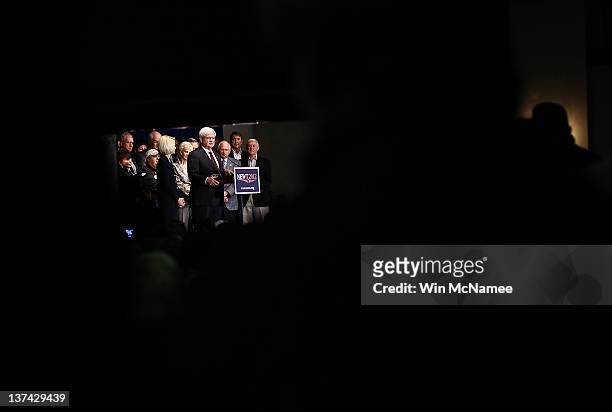 Republican presidential candidate, former Speaker of the House Newt Gingrich speaks to a main room and an overflow room during a town hall style...