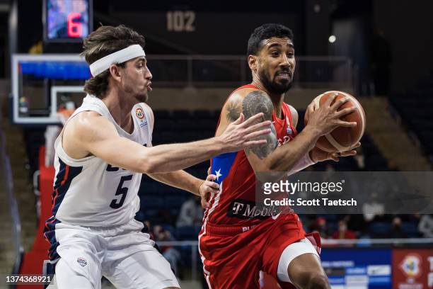 Jezreel De Jesus of Puerto Rico drives to the basket against David Stockton of Team USA during the second half of the FIBA Basketball World Cup 2023...