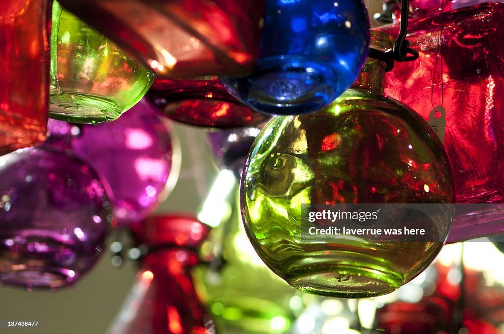 Colored glass bottle hanging