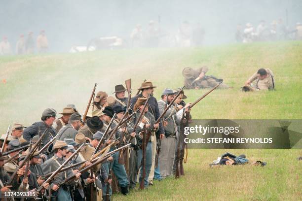 Reenactors are seen on the battlefield during the 160th reenactment of the Battle of Gettysburg, at Daniel Lady Farm in Gettysburg, Pennsylvania, on...