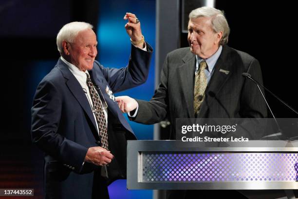 Cale Yarborough shows off his ring as he is inducted into the NASCAR Hall of Fame by Ken Squier during the 2012 NASCAR Hall of Fame induction...