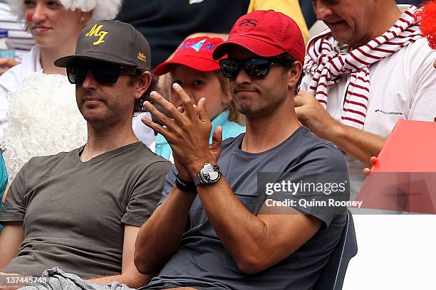 Partner of Ana Ivanovic of Serbia, Australian professional golfer, Adam Scott, watches the third round match between Ivanovic and Vania King of the...