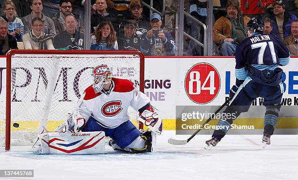 Evgeni Malkin of the Pittsburgh Penguins scores on his shootout attempt against Peter Budaj of the Montreal Canadiens on January 20, 2012 at Consol...