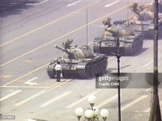 Lone demonstrator stands down a column of tanks June 5, 1989 at the entrance to Tiananmen Square in Beijing. The incident took place on the morning...