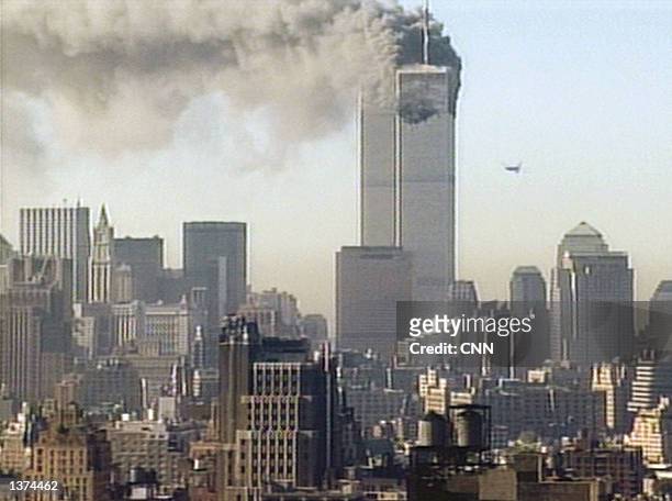 Hijacked United Airlines flight 175 flies towards the south tower of the World Trade Center on September 11, 2001 in New York City. The plane is one...