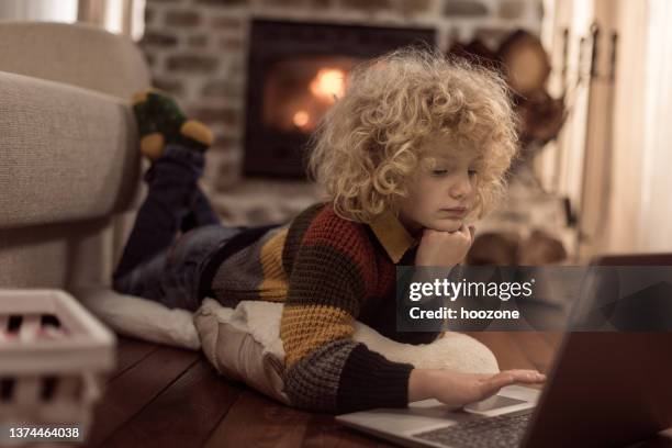 playing video games! - boy curly blonde stock pictures, royalty-free photos & images